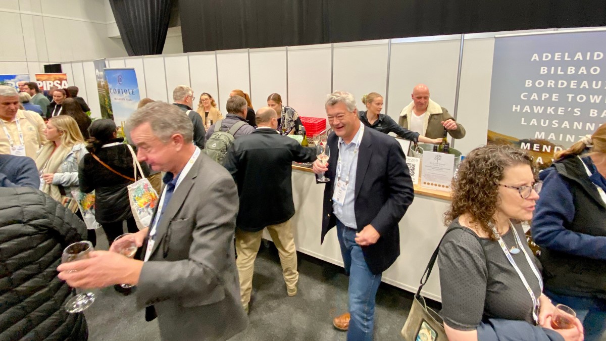 conference centre interior with people getting wine from a bar